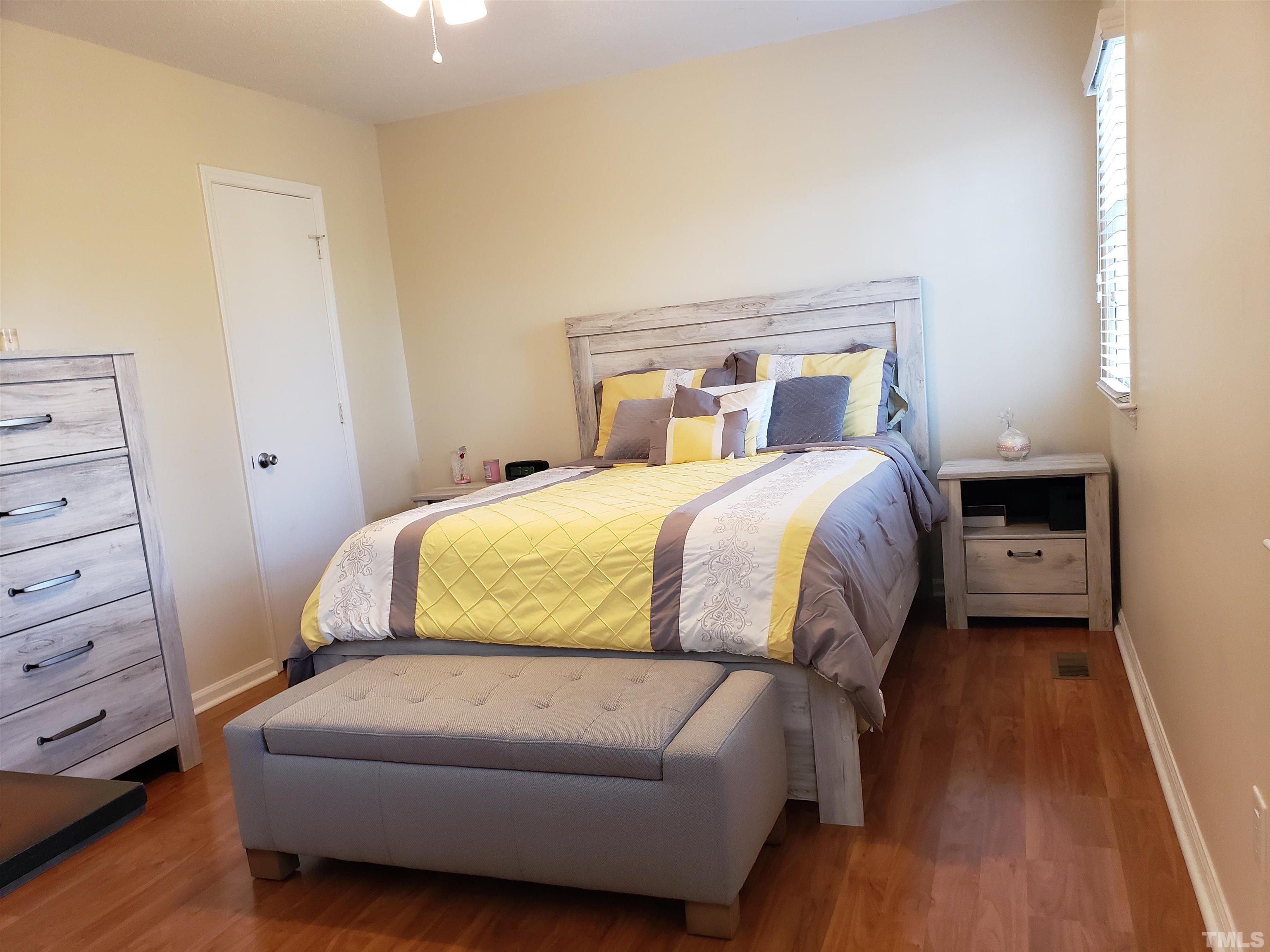 5610 Earl Road Durham, NC 27712 - Photo 16 of 38 a bedroom with a bed and a mirror