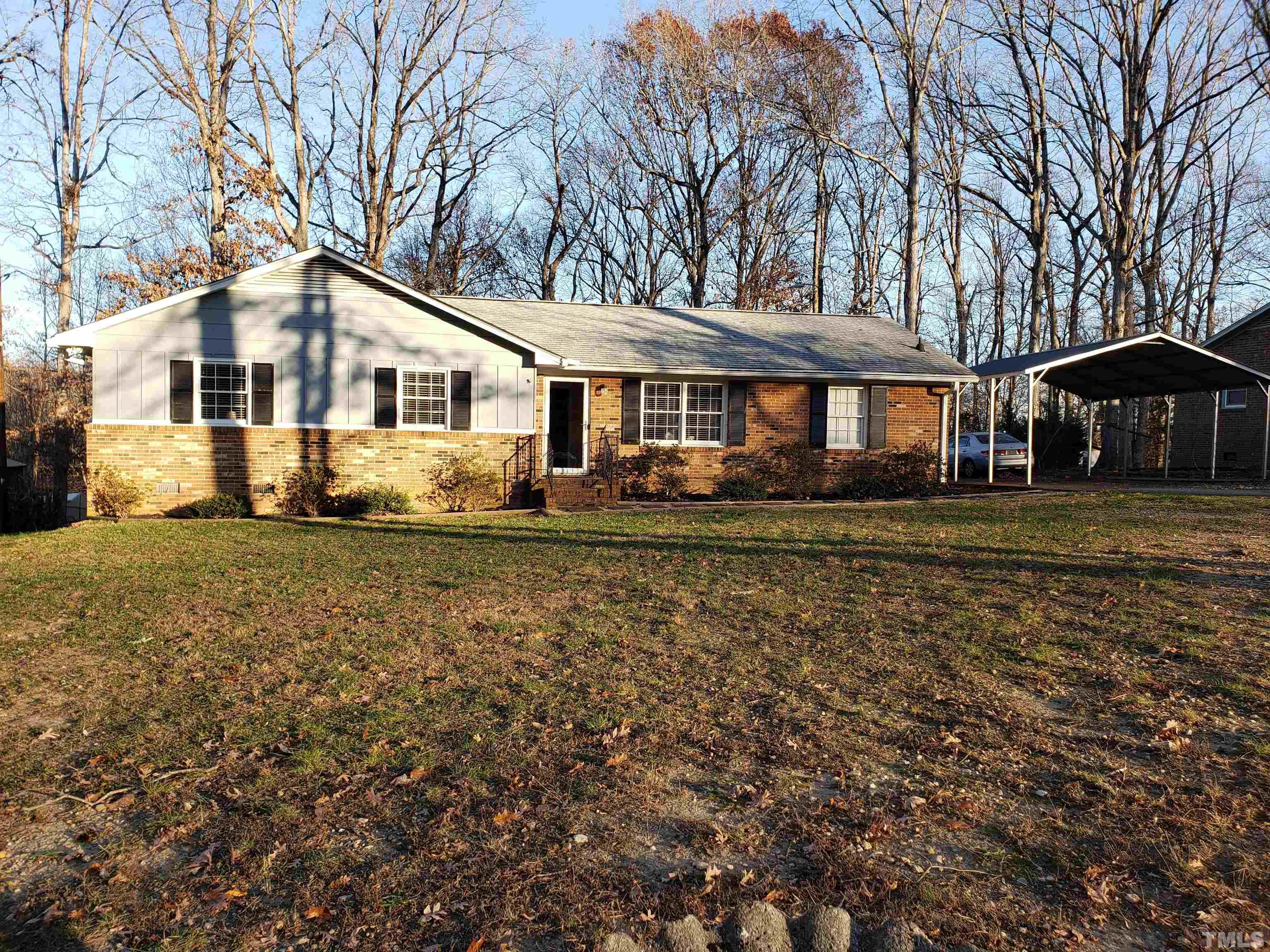 5610 Earl Road Durham, NC 27712 - Photo 3 of 38 a front view of a house with a yard