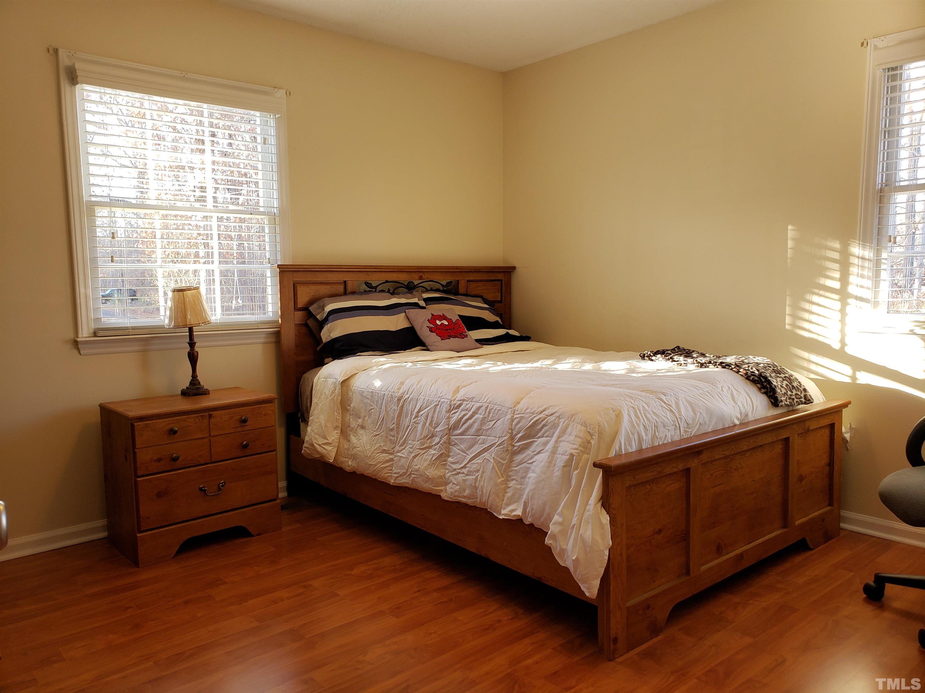 5610 Earl Road Durham, NC 27712 - Photo 21 of 38 a bedroom with a bed and a window