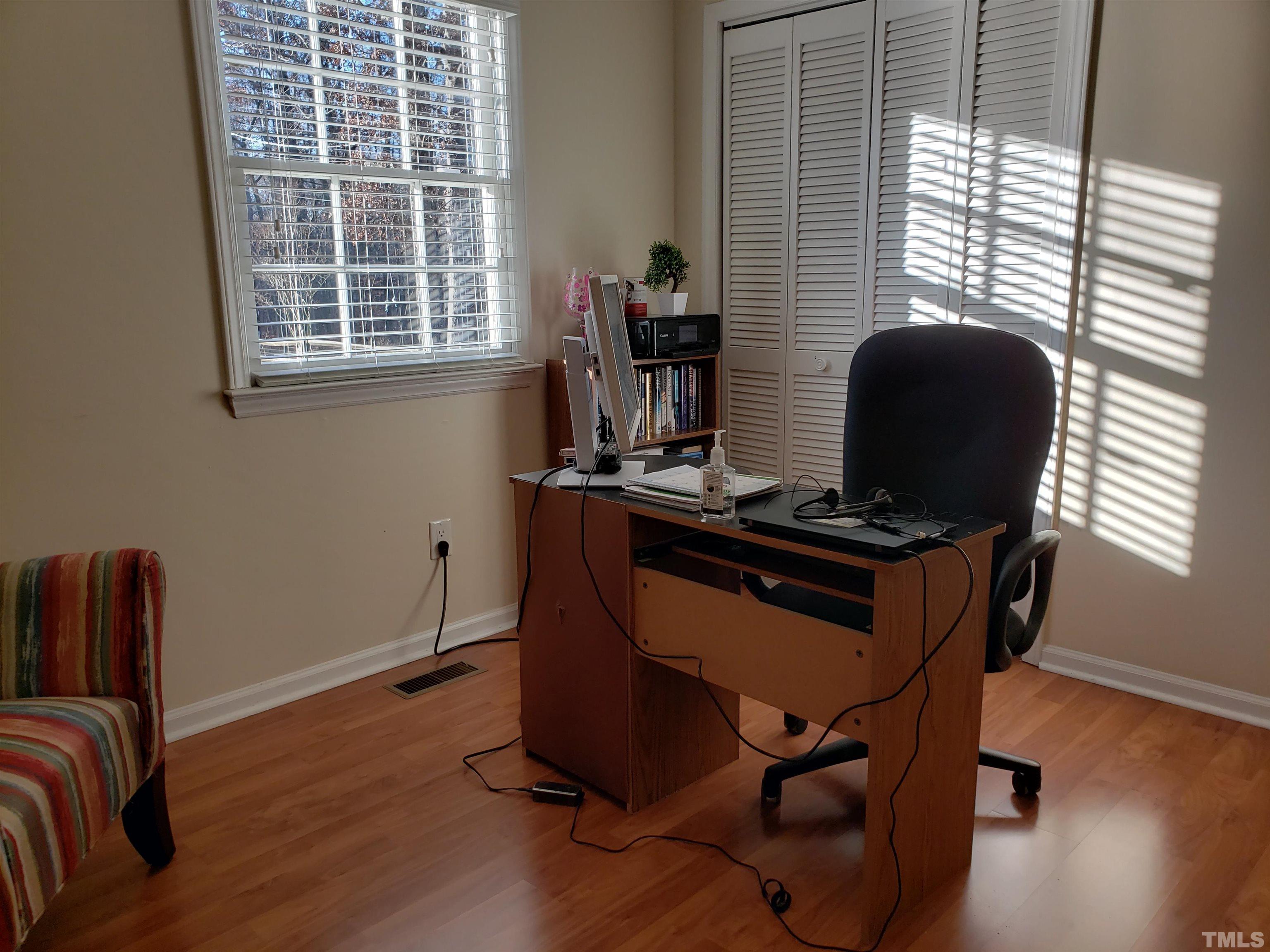 5610 Earl Road Durham, NC 27712 - Photo 22 of 38 a view of workspace with wooden floor windows