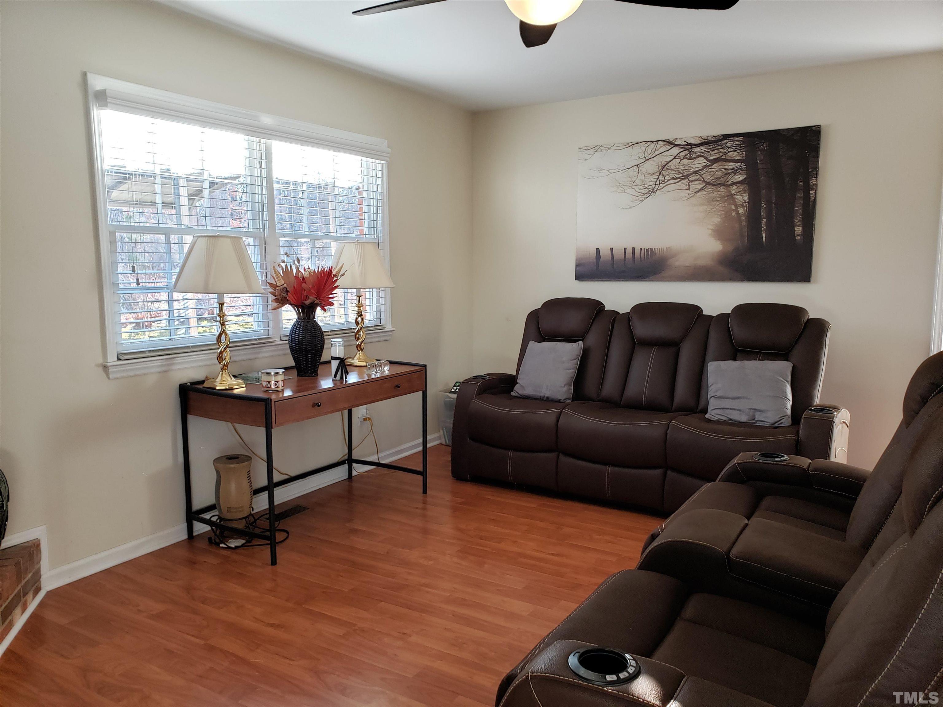 5610 Earl Road Durham, NC 27712 - Photo 26 of 38 a living room with furniture and a window