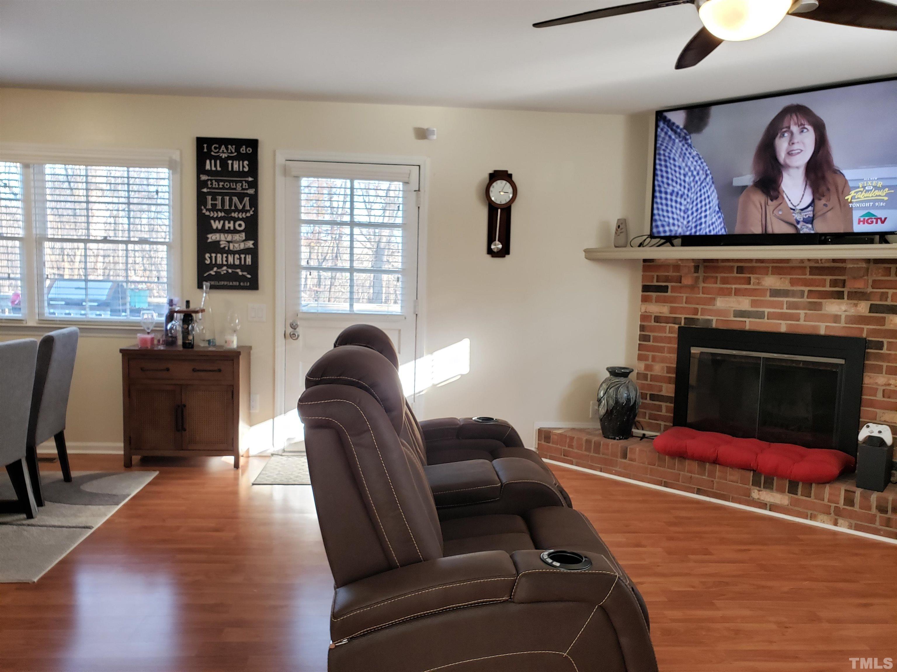 5610 Earl Road Durham, NC 27712 - Photo 28 of 38 a living room with furniture and a fireplace