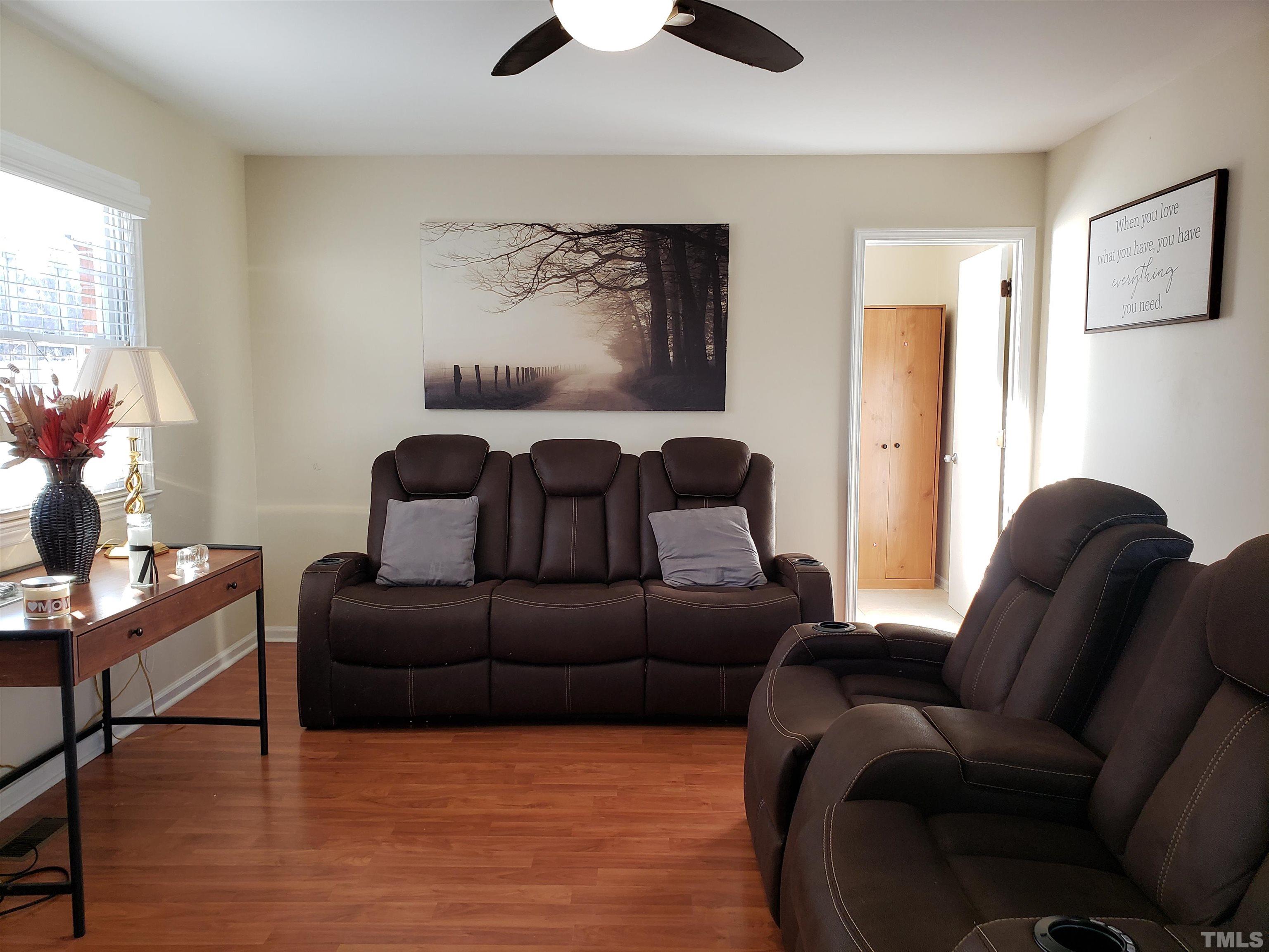 5610 Earl Road Durham, NC 27712 - Photo 29 of 38 a living room with furniture and a potted plant