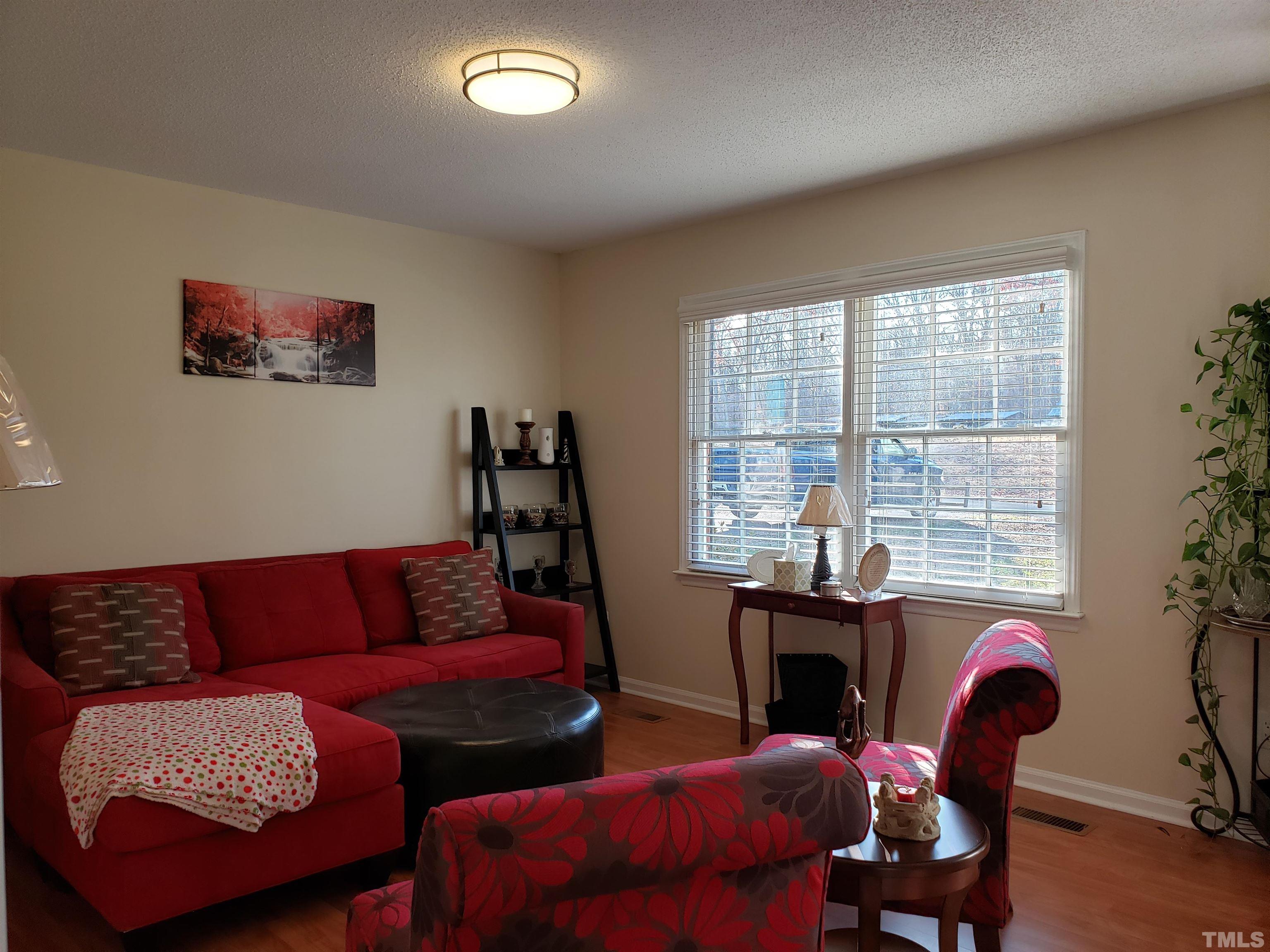 5610 Earl Road Durham, NC 27712 - Photo 10 of 38 a living room with furniture and a window
