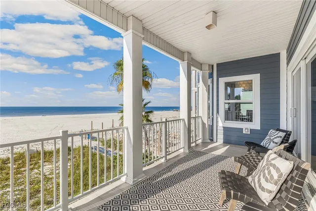 a view of a balcony with lake view and wooden floor