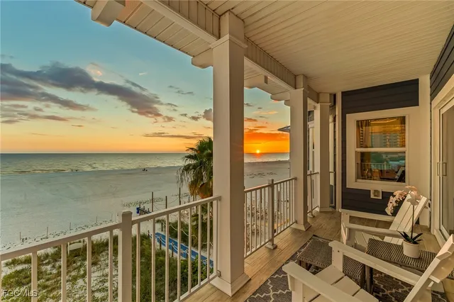 a view of a balcony with chairs