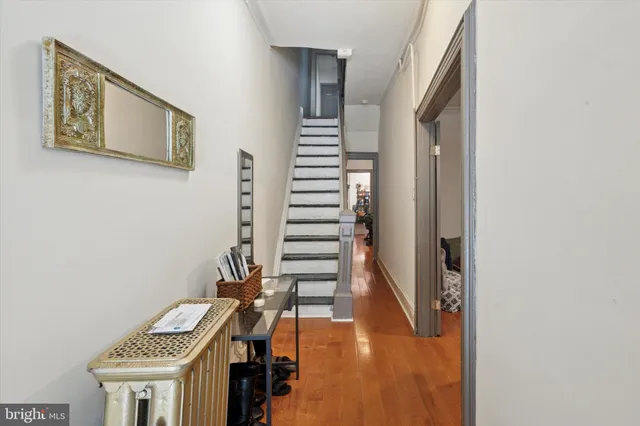 a view of entryway with wooden floor