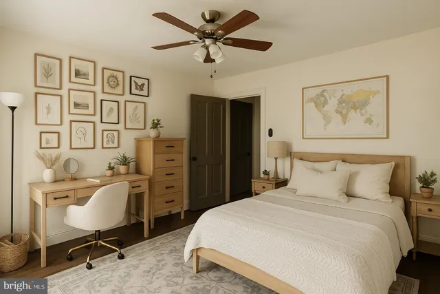 a bedroom with a bed and a desk