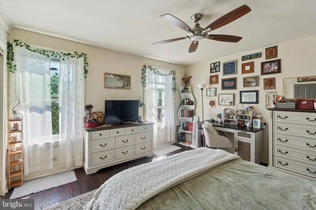 a bed room with a bed and a television