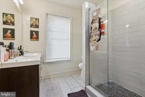 a bathroom with a sink and a shower