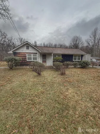 a front view of a house with yard