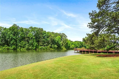 a view of a swimming pool with a lake view