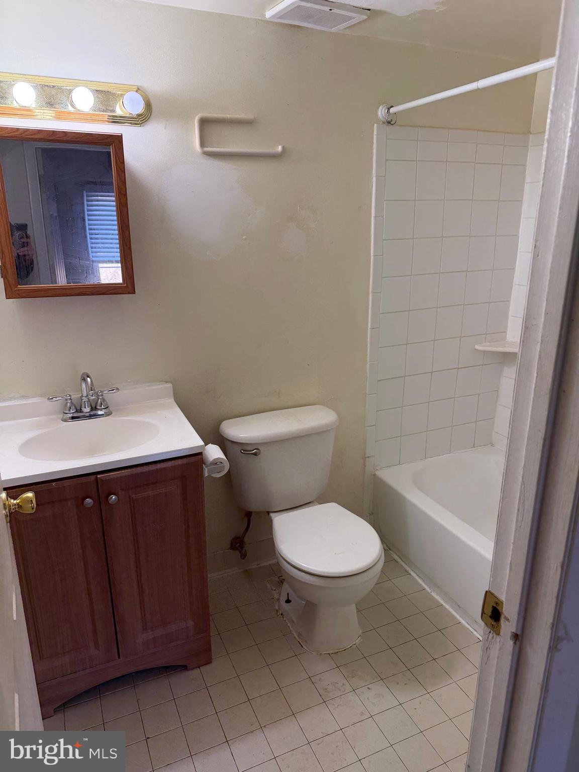 9342 Canterbury Riding, Unit 11 Laurel, MD 20723 - Photo 11 of 25 a bathroom with a sink toilet and shower