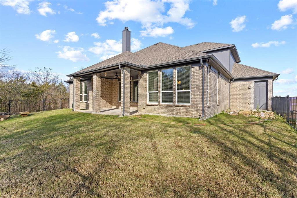 4001 Gentle Creek Lane Nevada, TX 75173 - Photo 37 of 40 a front view of a house with a garden