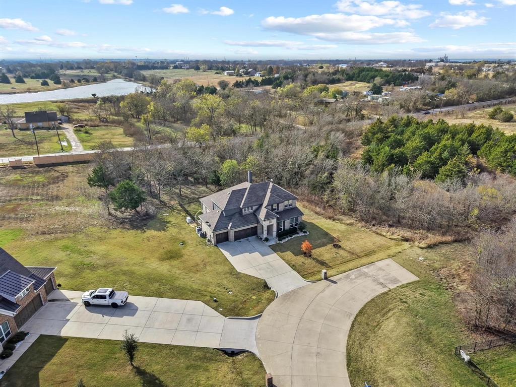 4001 Gentle Creek Lane Nevada, TX 75173 - Photo 38 of 40 a view of a swimming pool with a yard