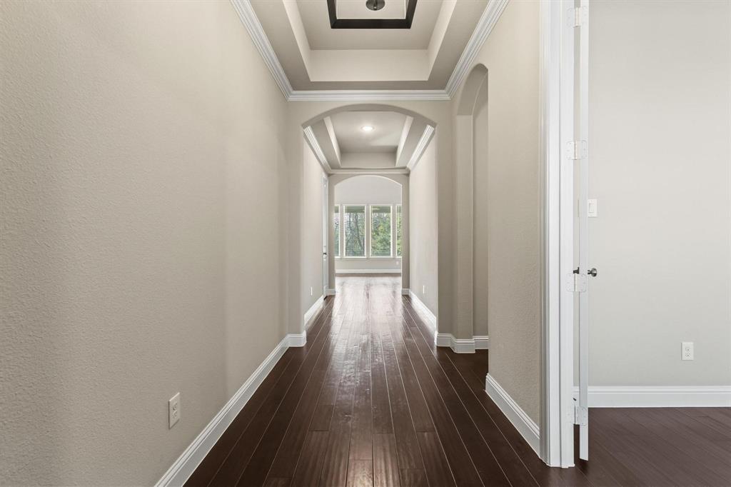 4001 Gentle Creek Lane Nevada, TX 75173 - Photo 6 of 40 a view of a hallway with wooden floor
