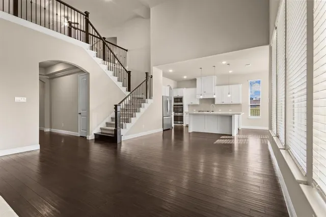 a view of an entryway with wooden floor