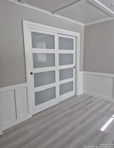 a view of an empty room with a closet