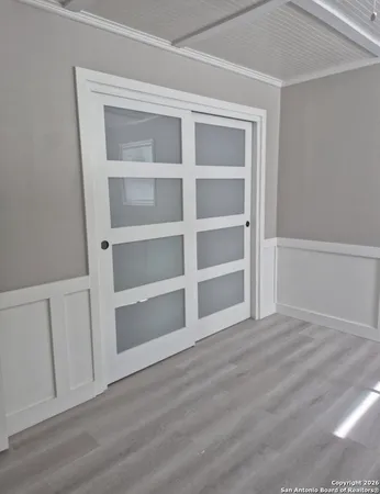 a view of an empty room with a closet