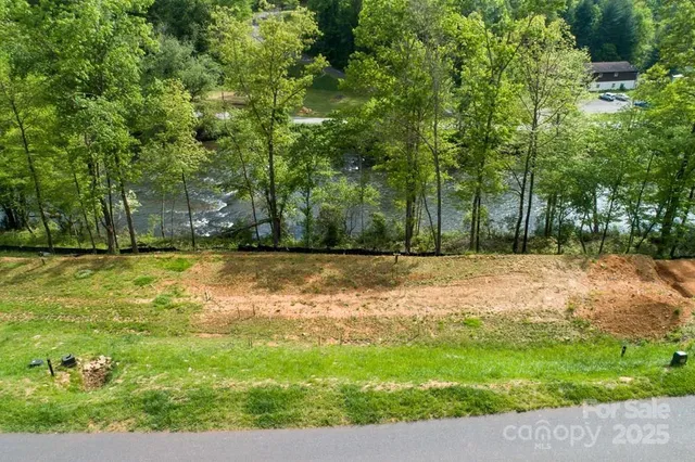 a swimming pool with trees in the background