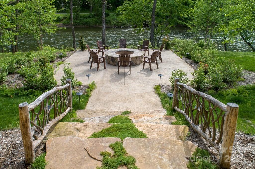 316 River Club Drive, Unit 3 Cullowhee, NC 28723 - Photo 13 of 23 a view of a dinning table and chairs in patio