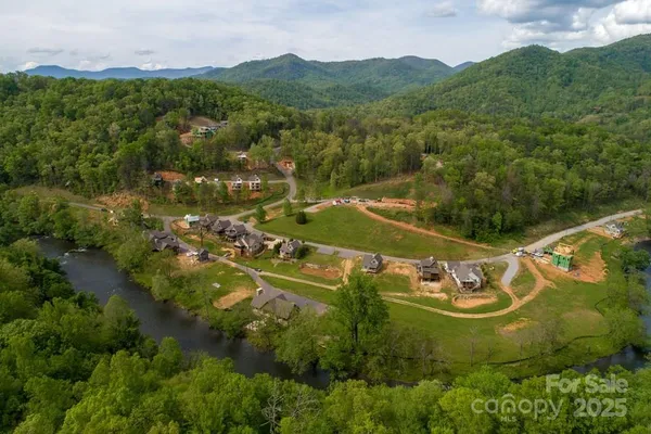 aerial view of a house with a yard