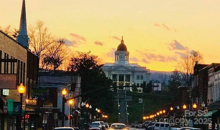 316 River Club Drive, Unit 3 Cullowhee, NC 28723 - Photo 22 of 23 a view of a house with a yard
