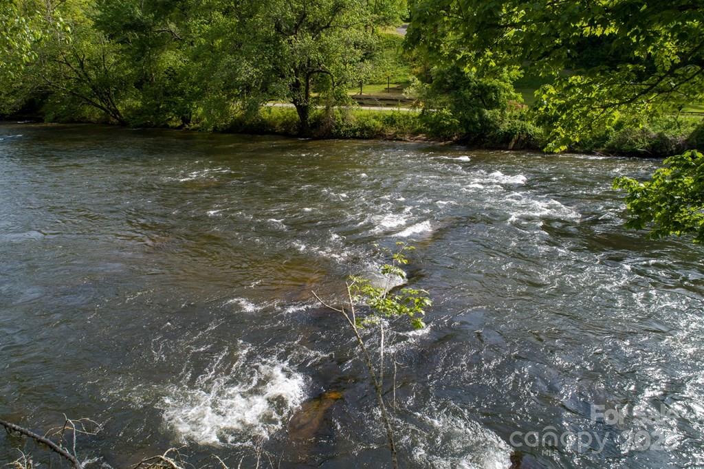 316 River Club Drive, Unit 3 Cullowhee, NC 28723 - Photo 4 of 23 a backyard of a house