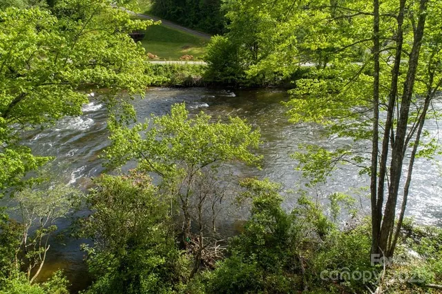 a view of lake with green space