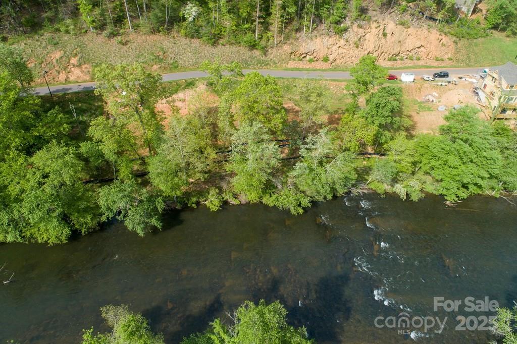 316 River Club Drive, Unit 3 Cullowhee, NC 28723 - Photo 6 of 23 a view of a lake with a yard