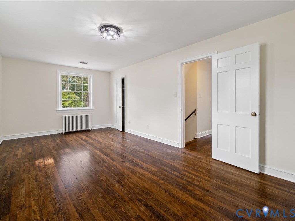 4803 Morrison Road Richmond, VA 23230 - Photo 30 of 45 an empty room with wooden floor and windows
