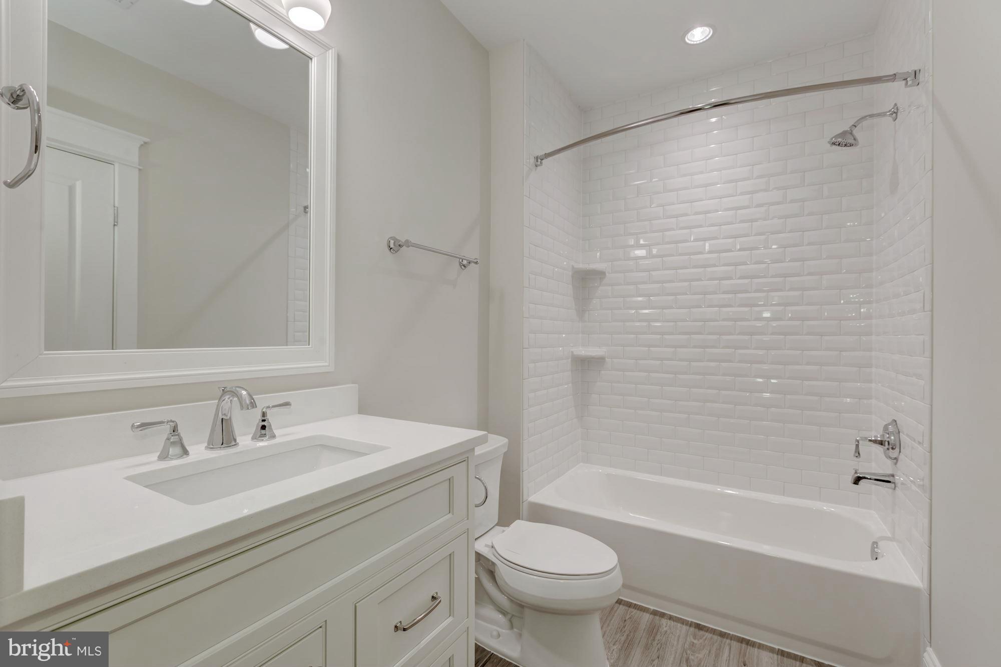 1600 Brookside Road McLean, VA 22101 - Photo 26 of 29 LL Full BA w/custom cabinetry and tile to ceiling
