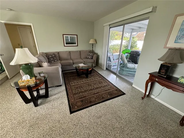 a view of a livingroom with furniture and windows