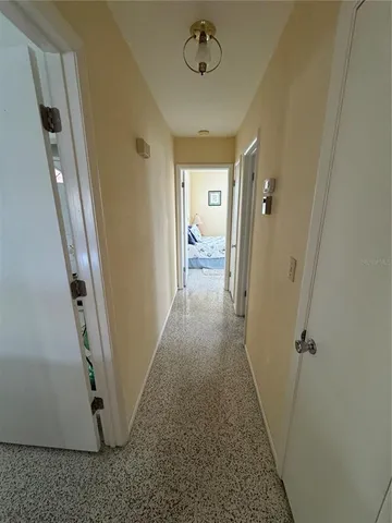a spacious bathroom with a granite countertop sink and a mirror