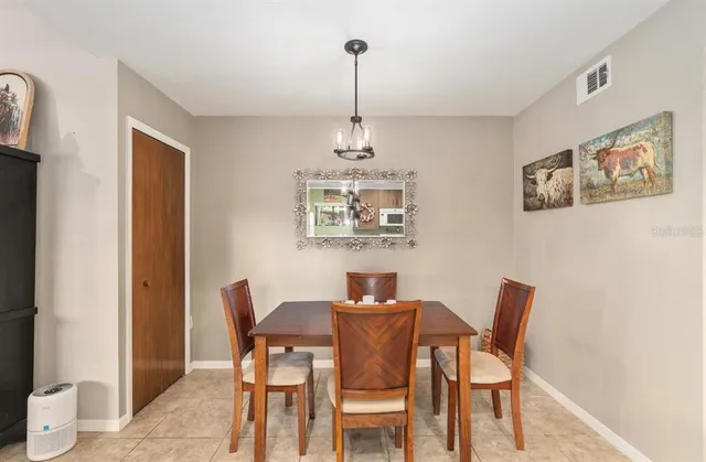 a kitchen with a refrigerator and a sink