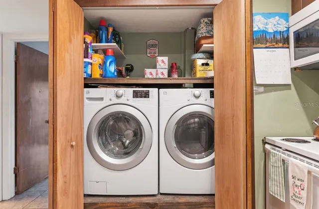 a bedroom with a bed and a tv on the dresser