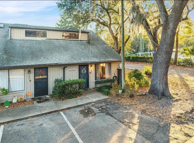 a living room with furniture a large window and a flat screen tv