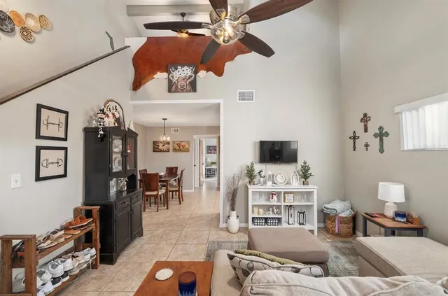 a living room with furniture and white walls