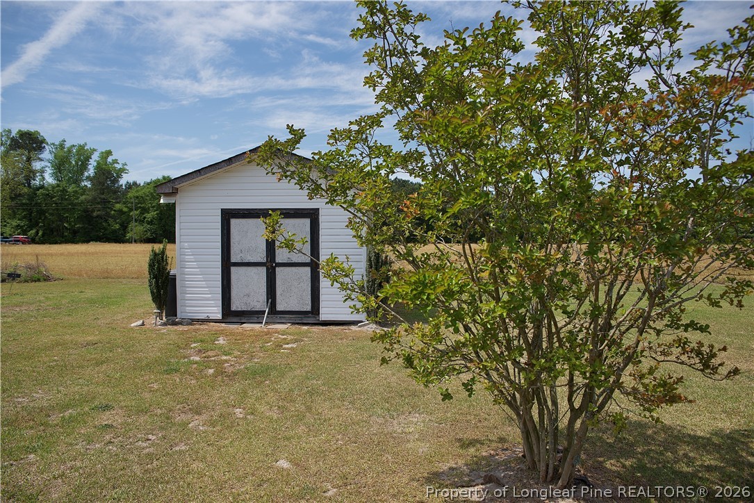 1071 Watts Road Lumberton, NC 28360 - Photo 29 of 31 a view of a house with a tree in front of it