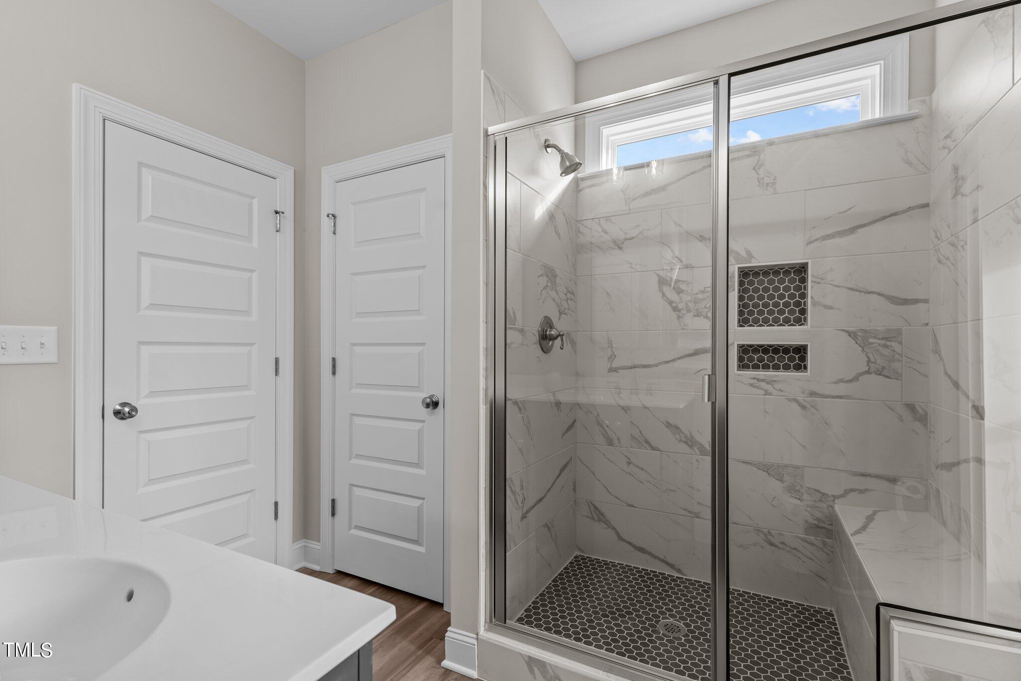 30 Brookhaven Drive Spring Hope, NC 27882 - Photo 11 of 20 a bathroom with a bathtub and a shower