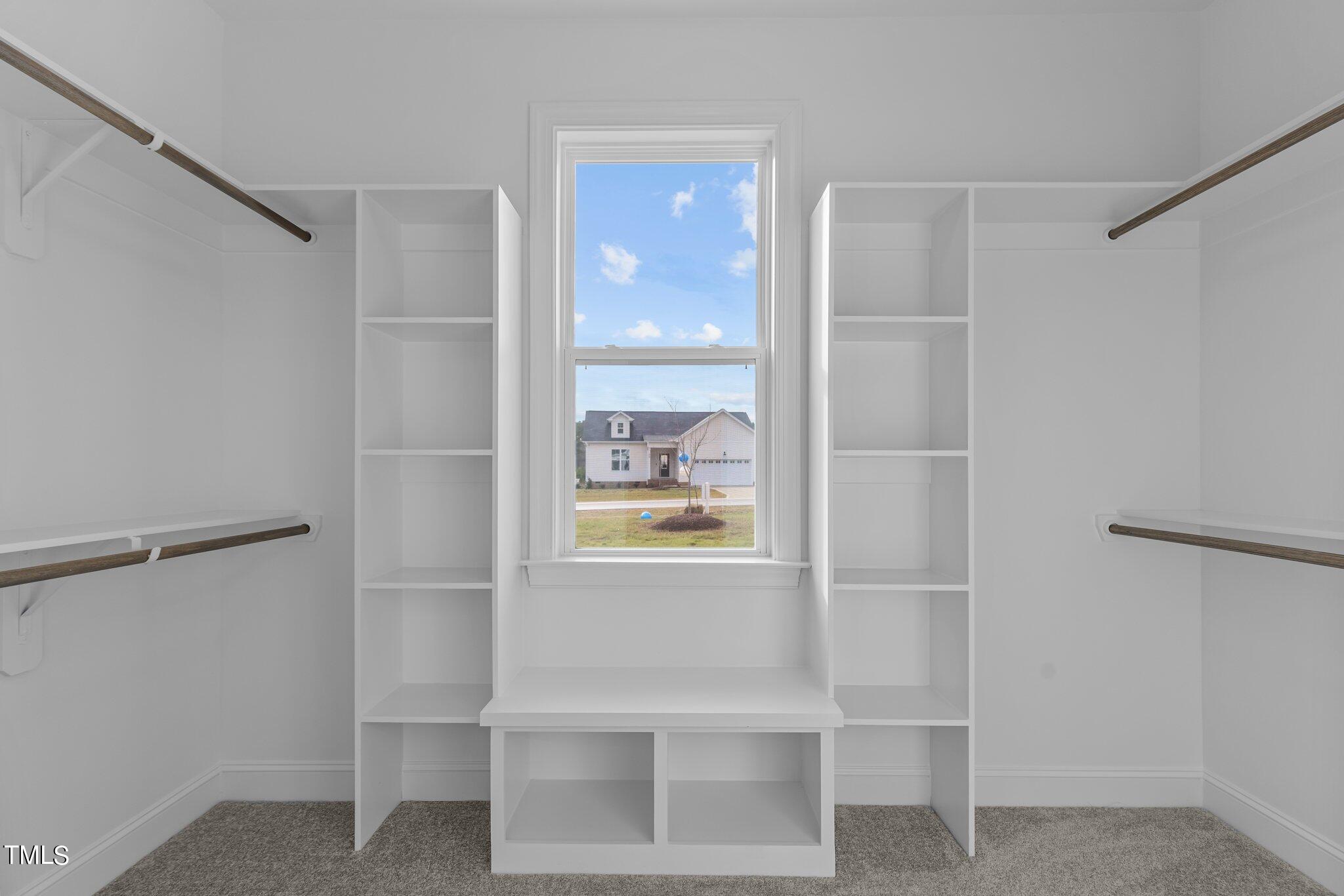 30 Brookhaven Drive Spring Hope, NC 27882 - Photo 12 of 20 a bathroom with a walk in closet and window
