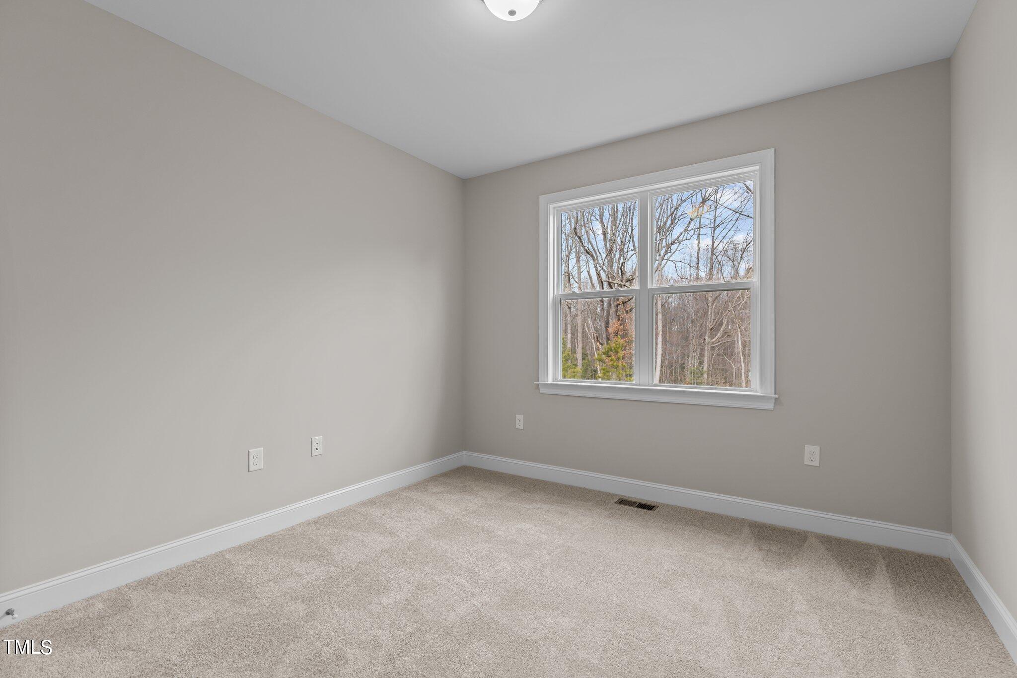 30 Brookhaven Drive Spring Hope, NC 27882 - Photo 13 of 20 an empty room with a window