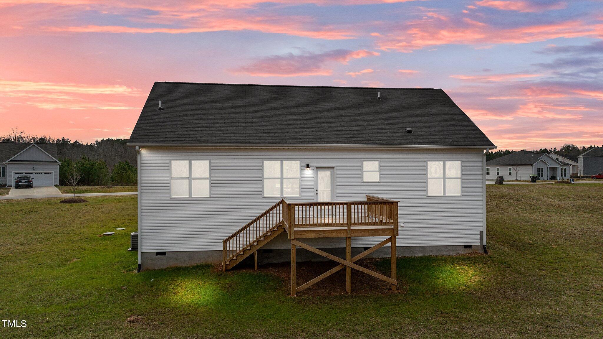 30 Brookhaven Drive Spring Hope, NC 27882 - Photo 16 of 20 a backyard of a house with table and chairs