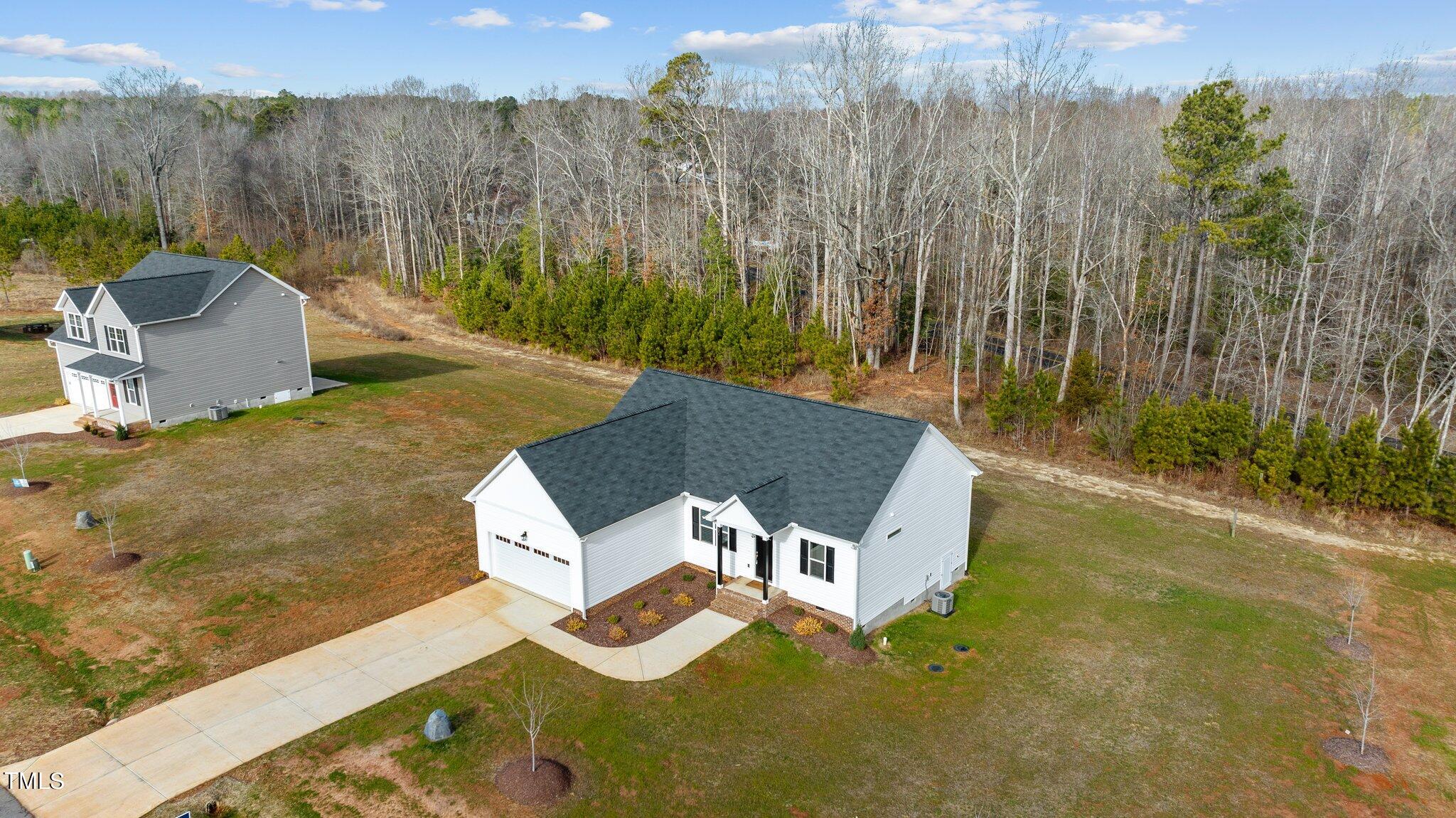 30 Brookhaven Drive Spring Hope, NC 27882 - Photo 19 of 20 a view of a house with backyard and trees