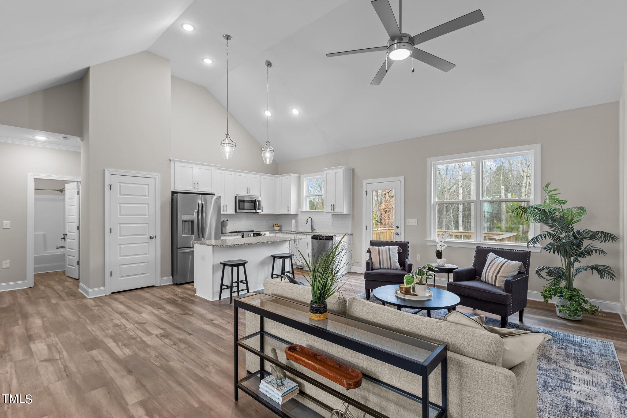 30 Brookhaven Drive Spring Hope, NC 27882 - Photo 5 of 20 a living room with lots of furniture and kitchen view