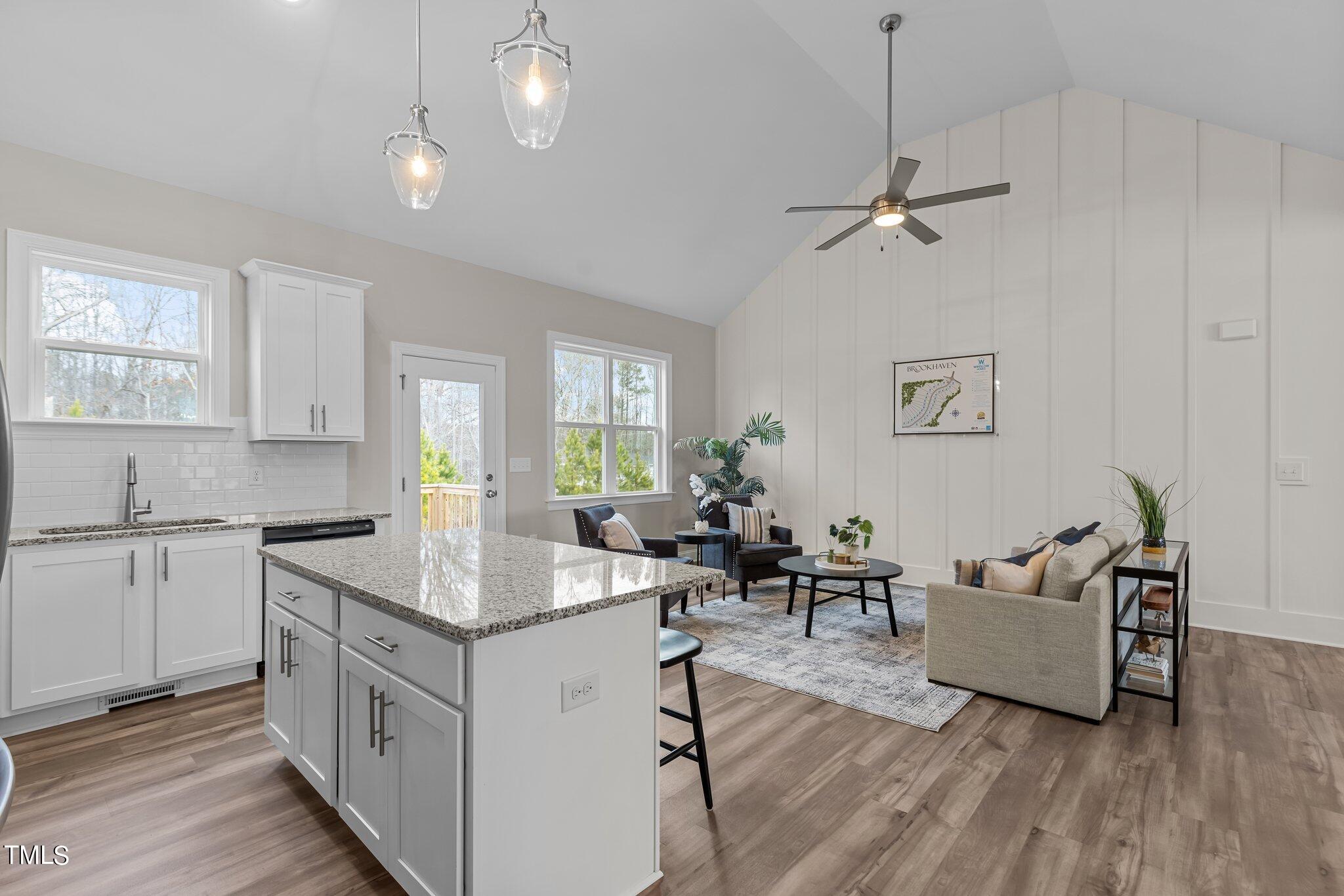 30 Brookhaven Drive Spring Hope, NC 27882 - Photo 6 of 20 a open kitchen with sink cabinets and wooden floor