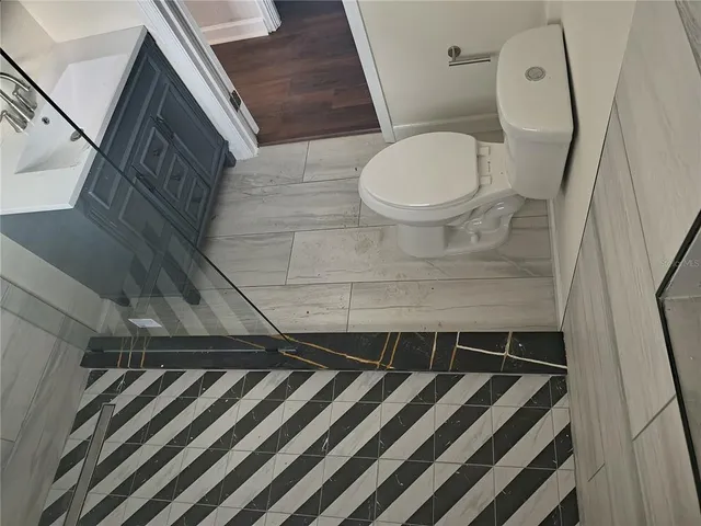 a bathroom with a toilet and a sink