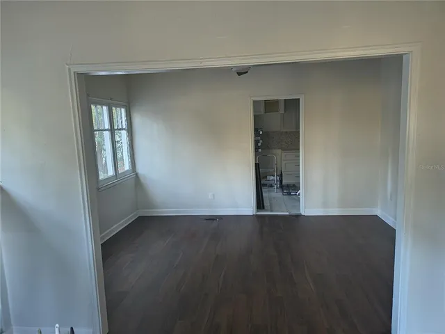 a kitchen with granite countertop a sink and cabinets