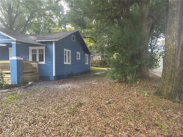 a house view with a backyard space