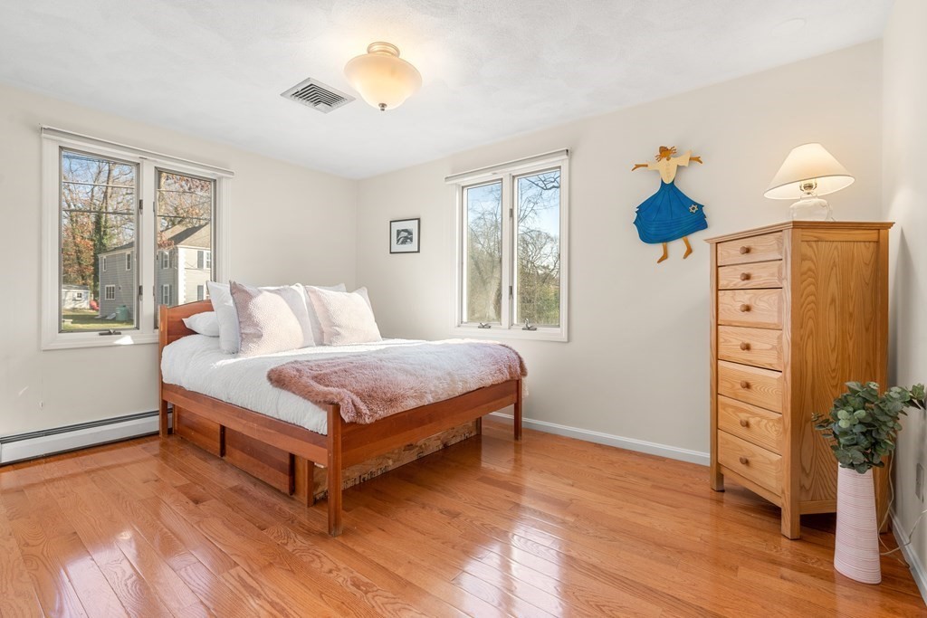93 Gayland Road Needham, MA 02492 - Photo 15 of 36 a bedroom with a bed closet and a window